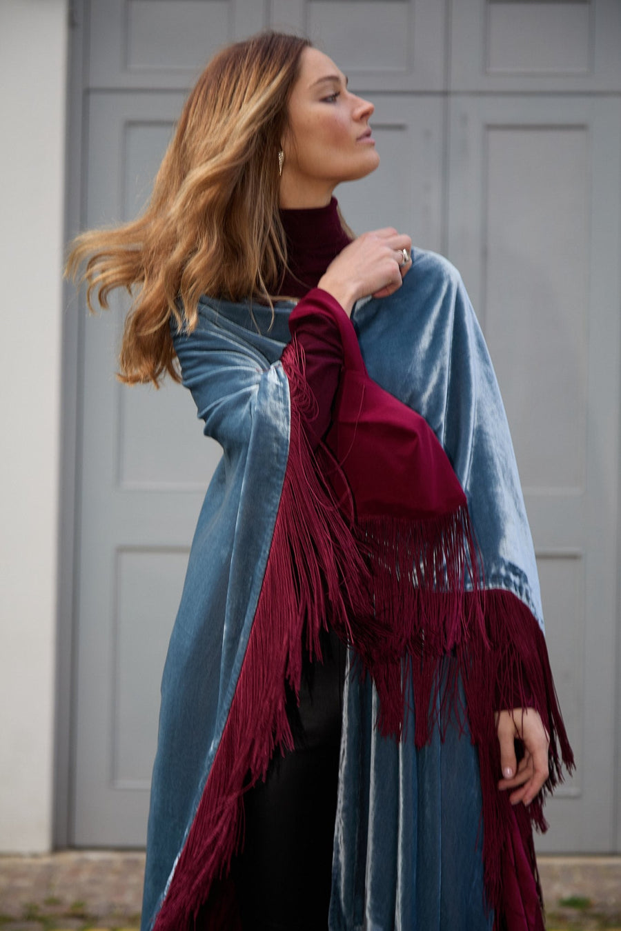 The Summer Cloud Poncho thrown over the shoulder
