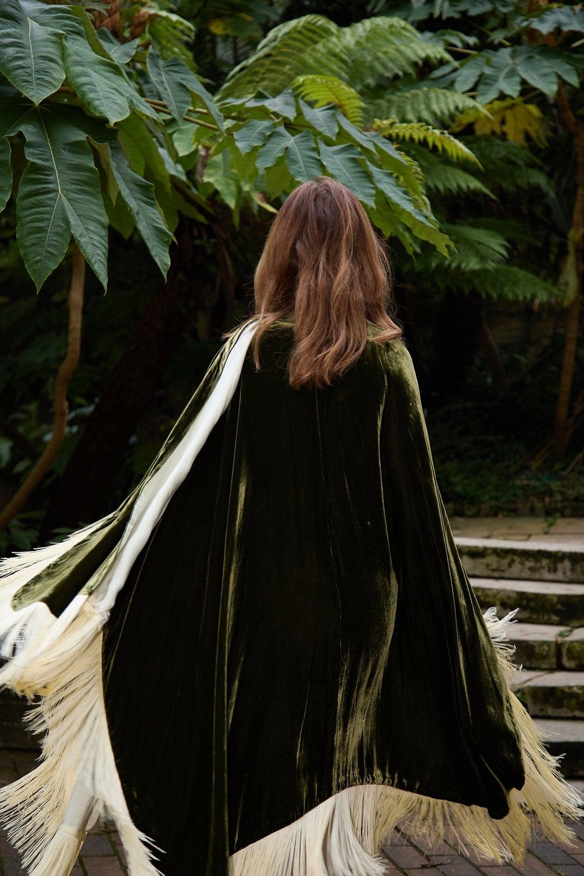 The Evergreen Poncho, the cream fringe in motion