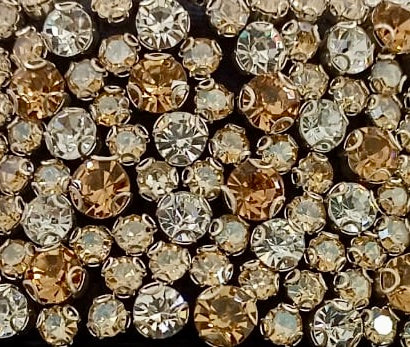 Hand-sewn golden sequins and crystals on the collar of the Golden Collar Cape, detail