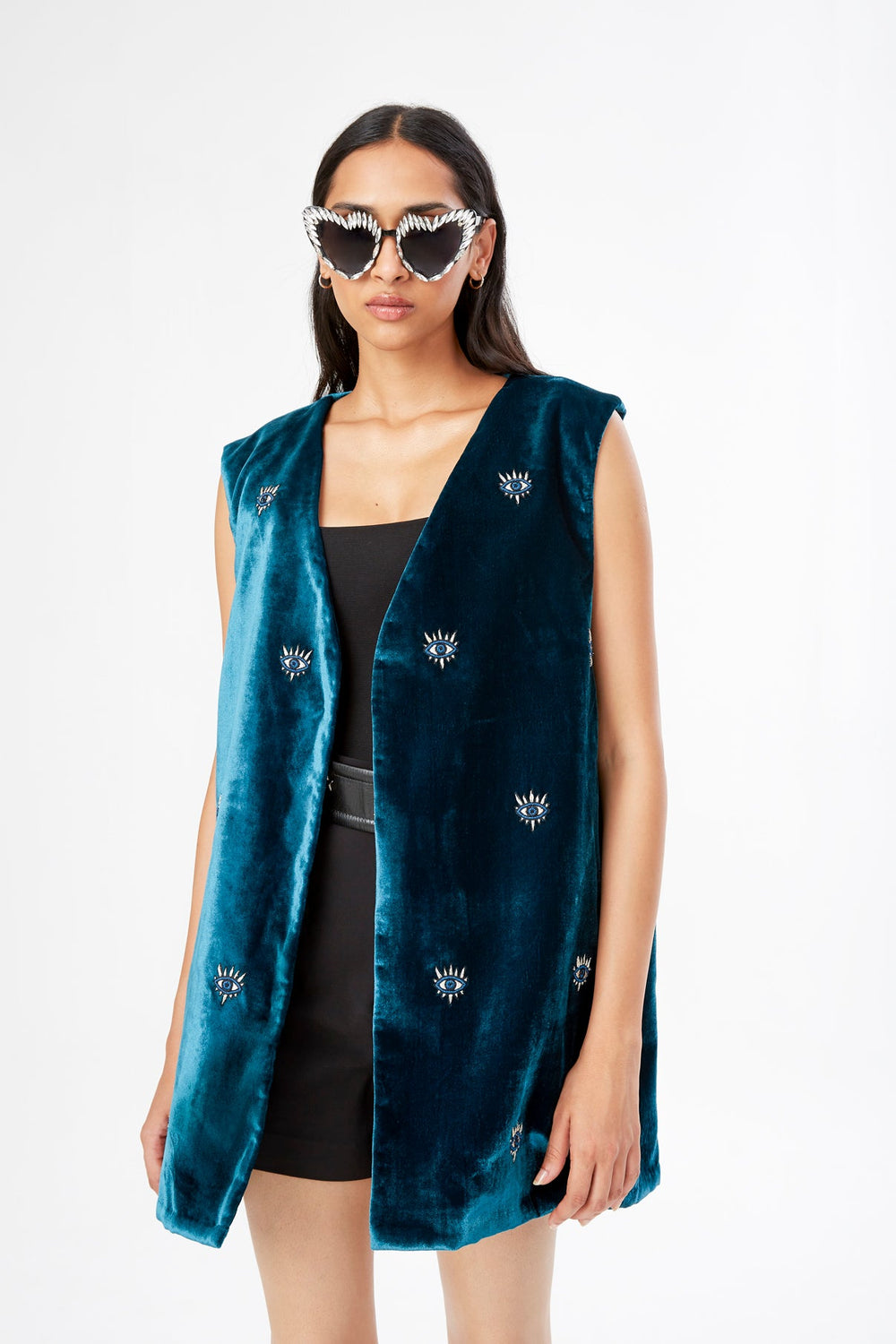The 'All Eyes on You' Vest in petrol silk velvet with eye embroidery, close-up, studio