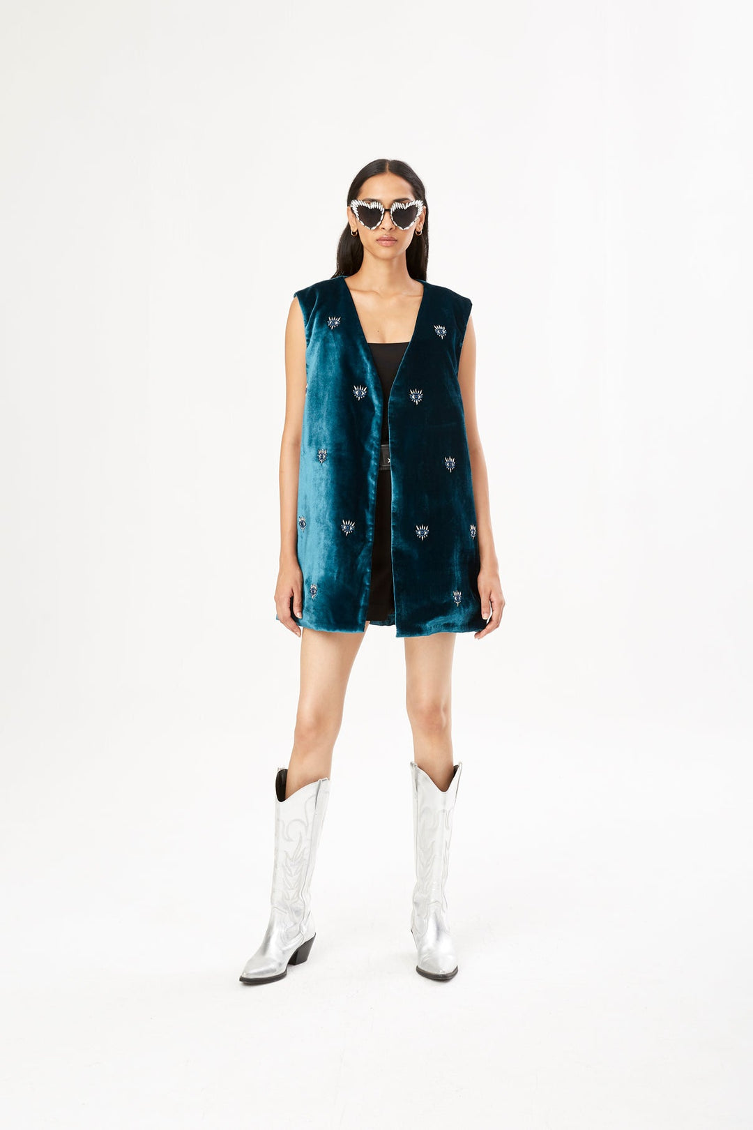 The 'All Eyes on You' Vest in petrol silk velvet with eye embroidery, front view, studio