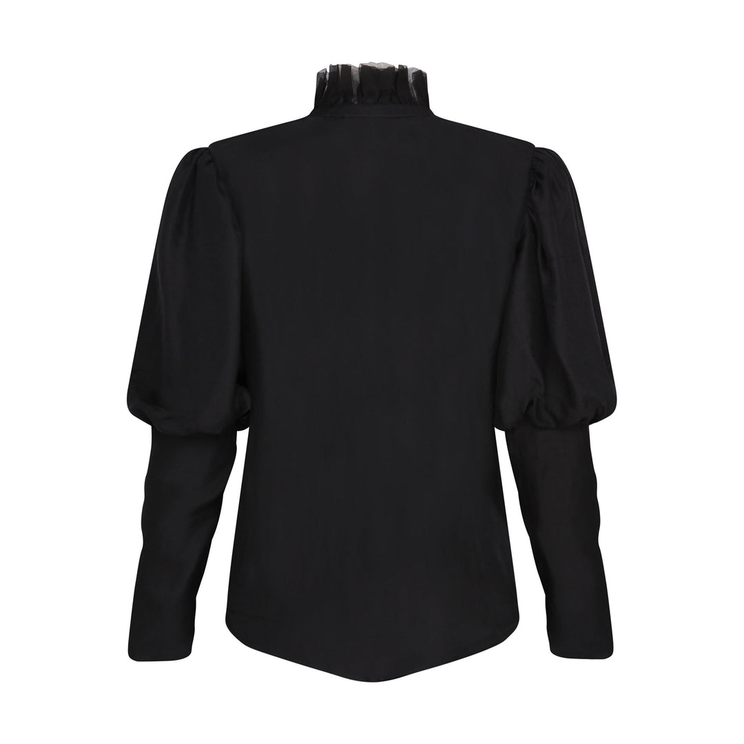 The Black Puff Ruffle Blouse in black silk twill, flat lay back, studio