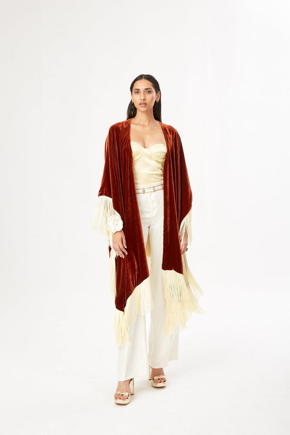 The Bronze Poncho in bronze silk velvet with cream fringe, front view, studio