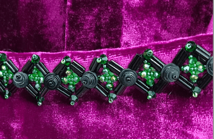 The Dahlia Coat in magenta silk velvet with embroidered trim, embroidered trim detail