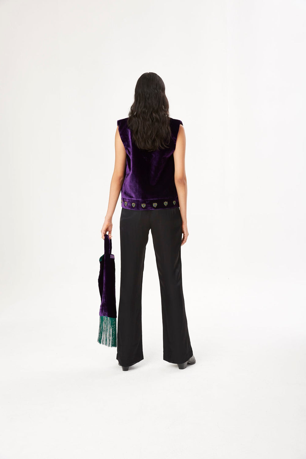 The 'Eye to Eye' Vest in deep purple silk velvet with eye embroidery, back view, studio