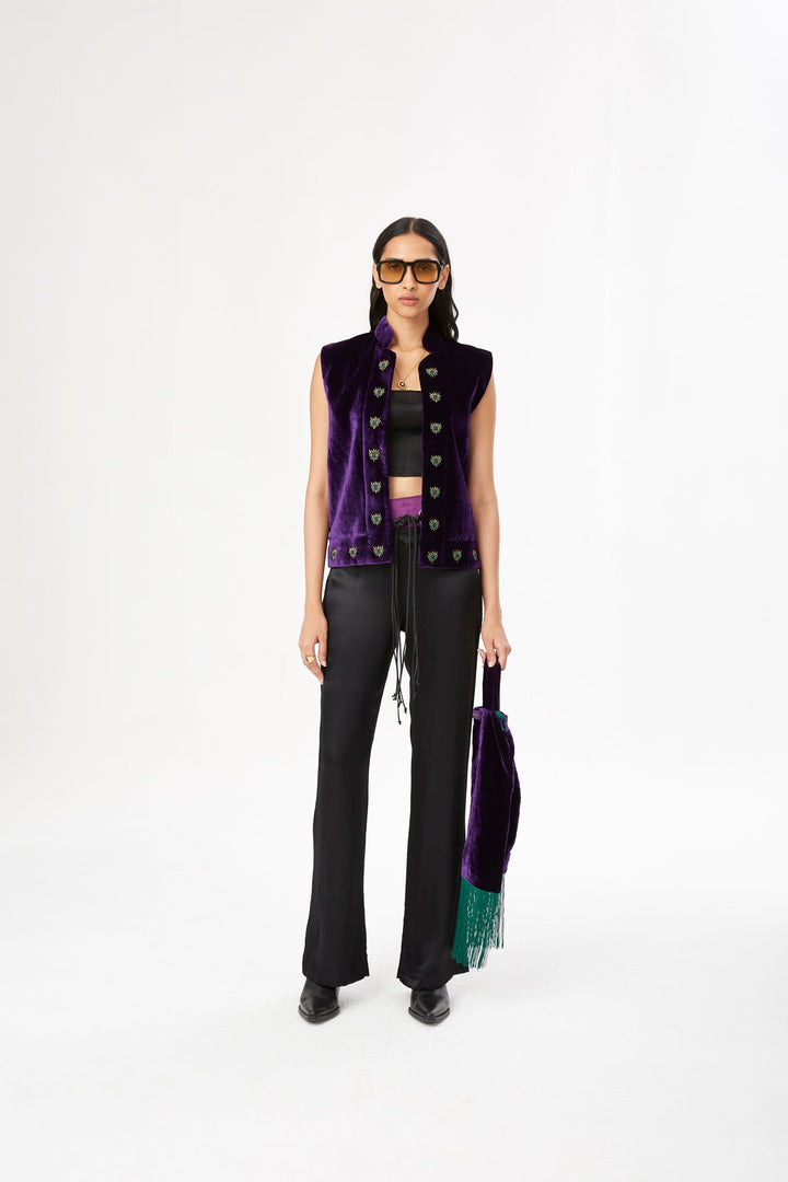 The 'Eye to Eye' Vest in deep purple silk velvet with eye embroidery, front view, studio