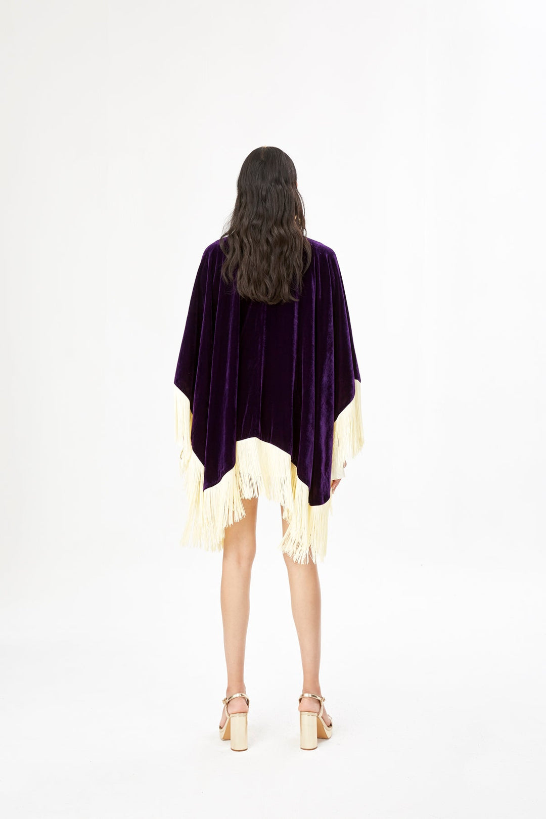 The Gatsby Poncho in purple silk velvet with champagne fringe, back view, studio