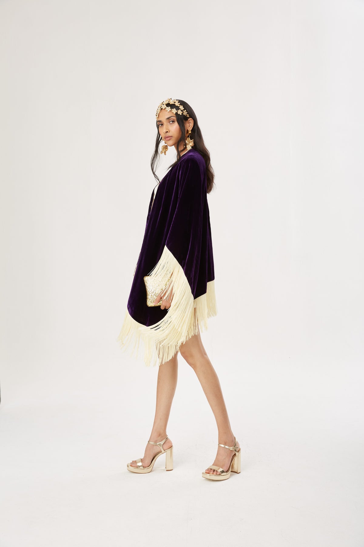 The Gatsby Poncho in purple silk velvet with champagne fringe, worn, studio