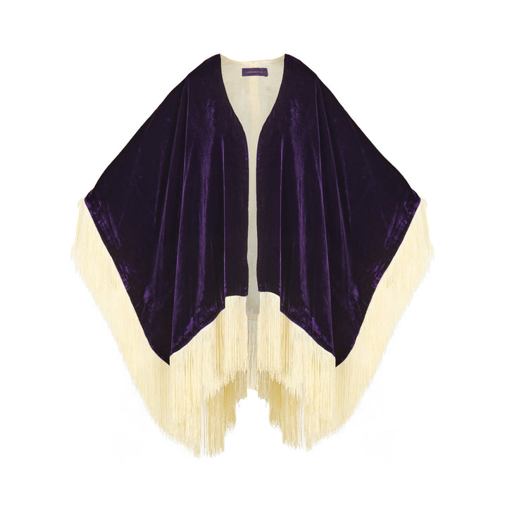 The Gatsby Poncho in purple silk velvet with champagne fringe, flat lay, studio