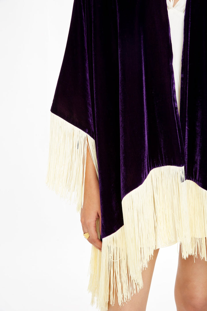 The Gatsby Poncho in purple silk velvet with champagne fringe, velvet and fringe detail, studio