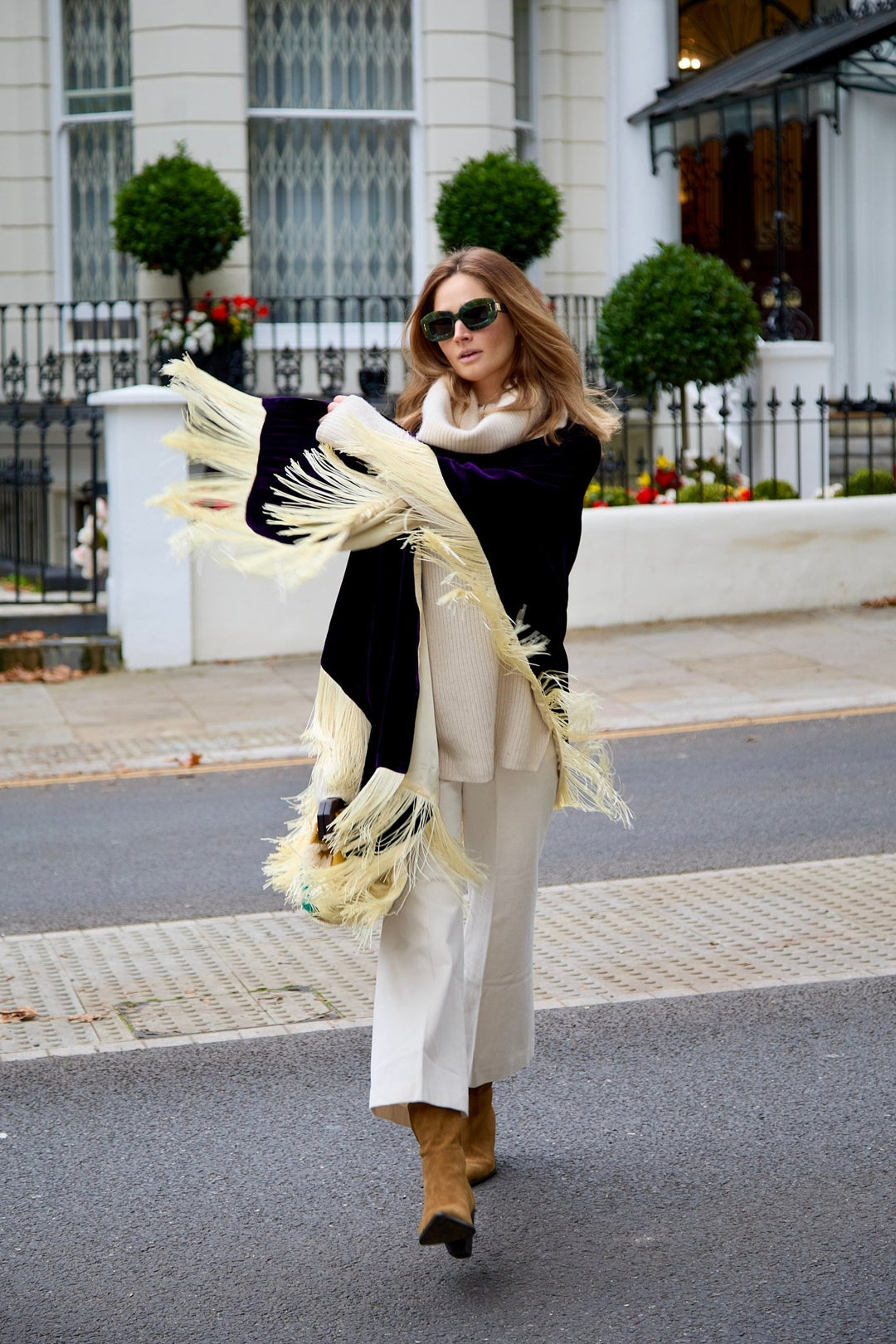 The Gatsby Poncho in purple silk velvet with champagne fringe, walking, London street