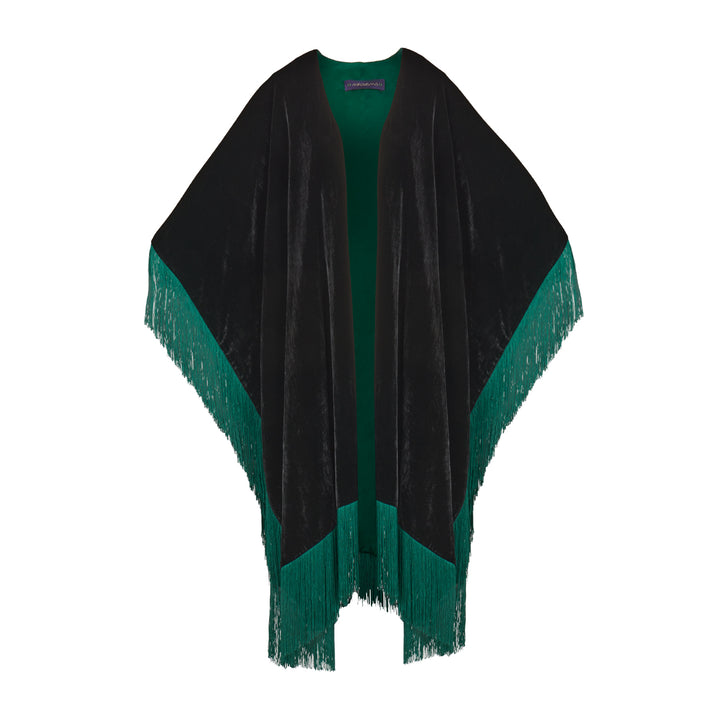 The Gypset Poncho in black silk velvet with emerald fringe, flat lay, studio