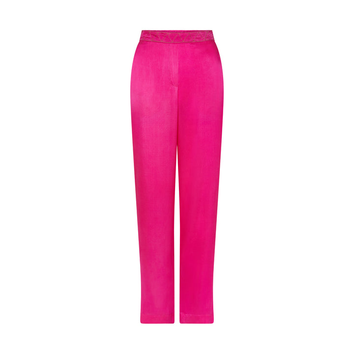 The Hot Pink Trousers in hot pink silk, flat lay, studio