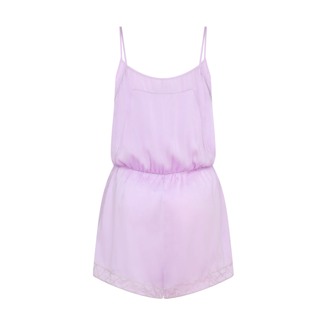 The Lavender Playsuit in lavender silk, flat lay back, studio