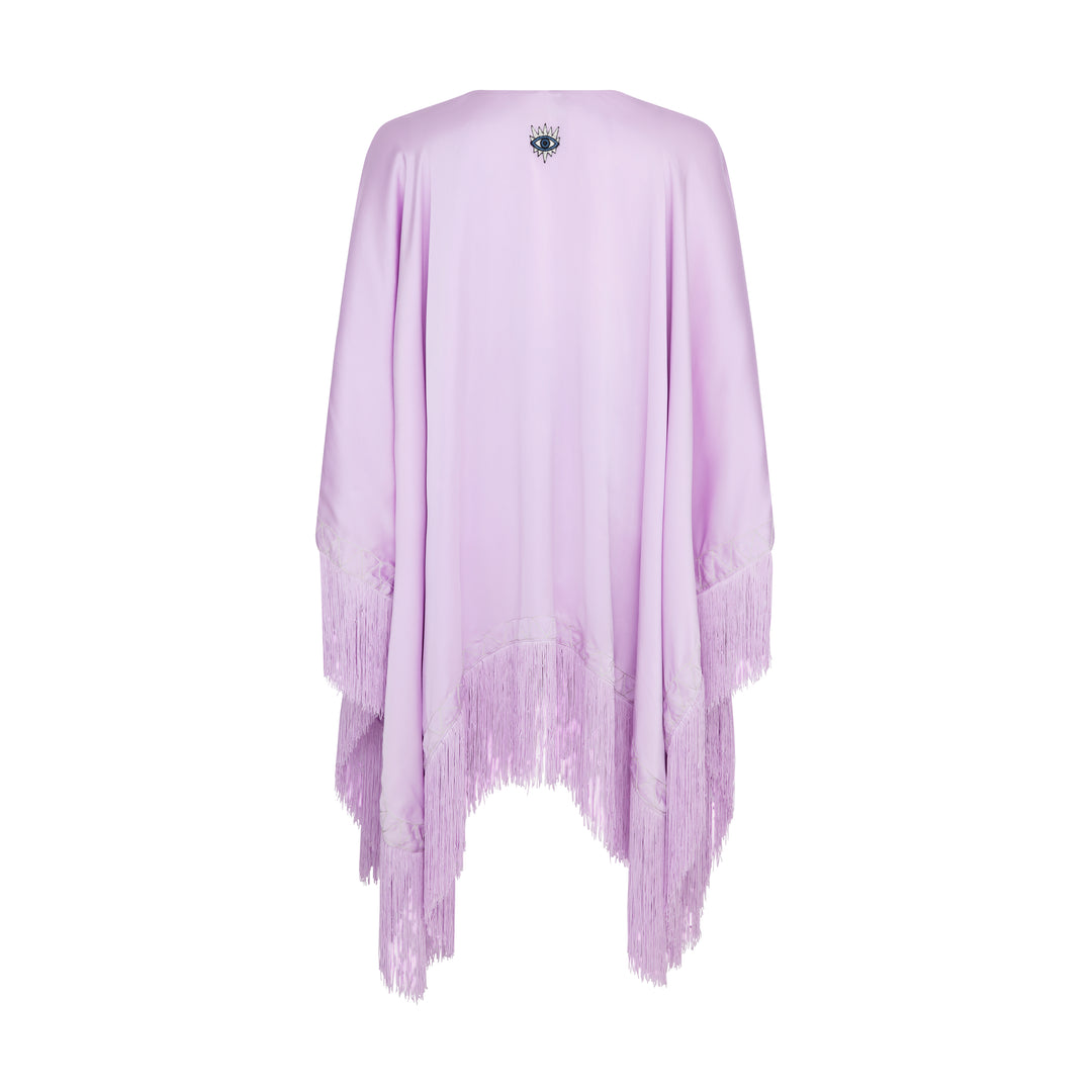 The Lavender Poncho in lavender silk with fringed hem, flat lay back, studio