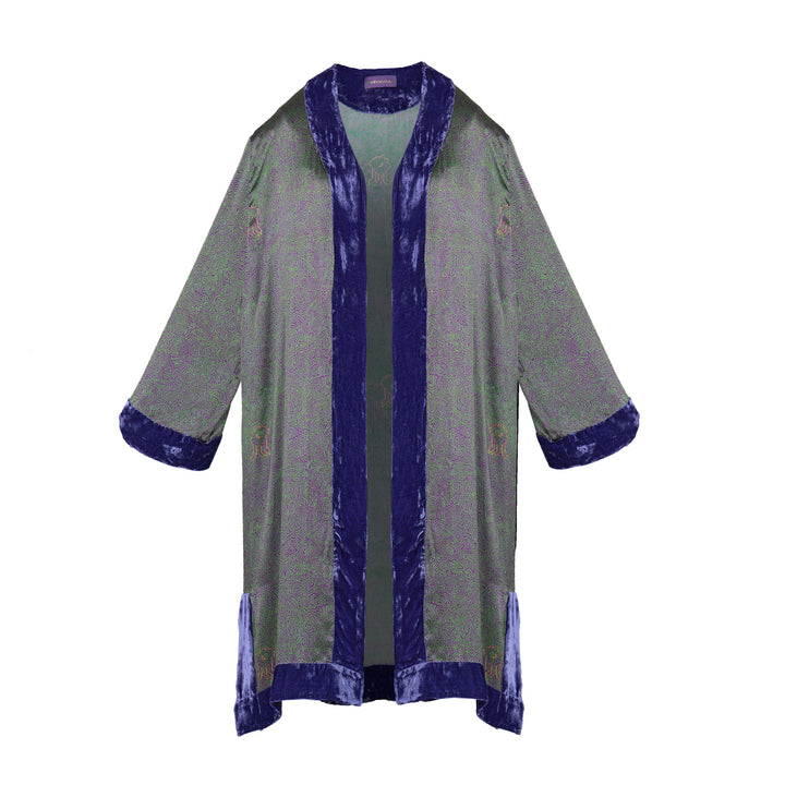 The Mazestroom Kimono, Purple and Green, in iridescent green and purple maze-print silk with velvet trim, flat lay, studio