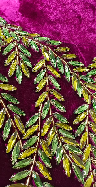 The Royal Garden Cape in magenta silk velvet with gold and green leaf embroidery, leaf embroidery detail