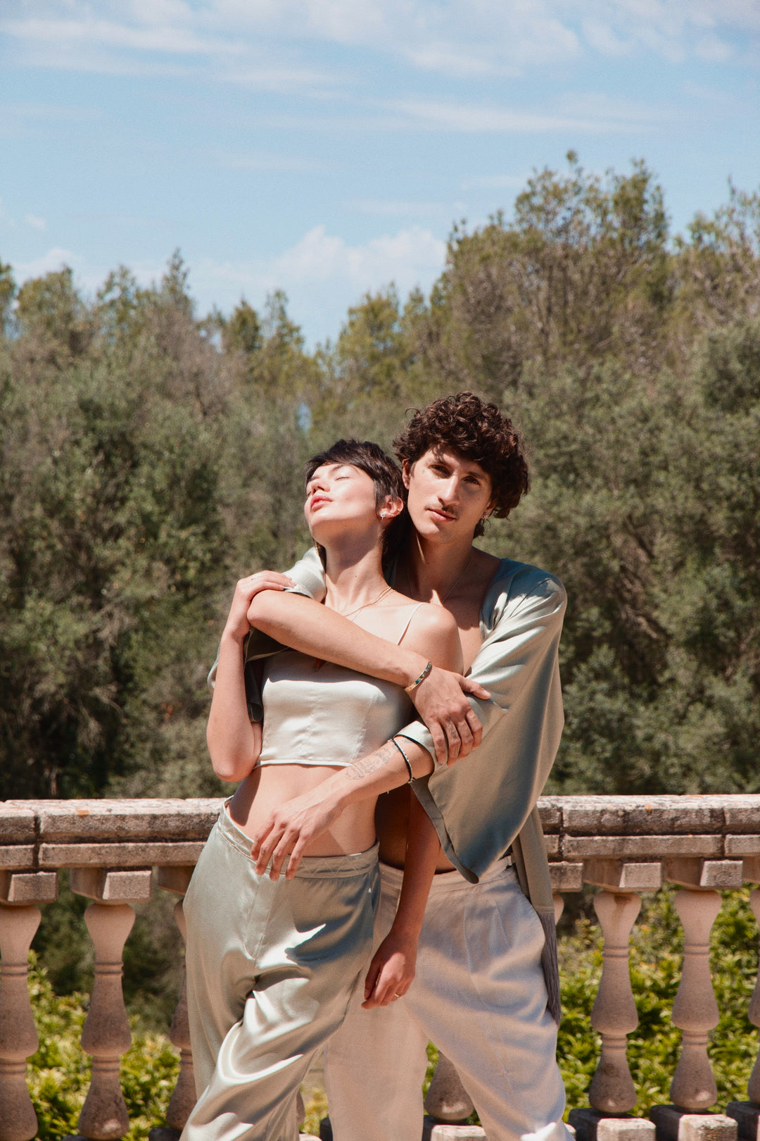 The Sage Bandeau Top in sage silk, stone terrace