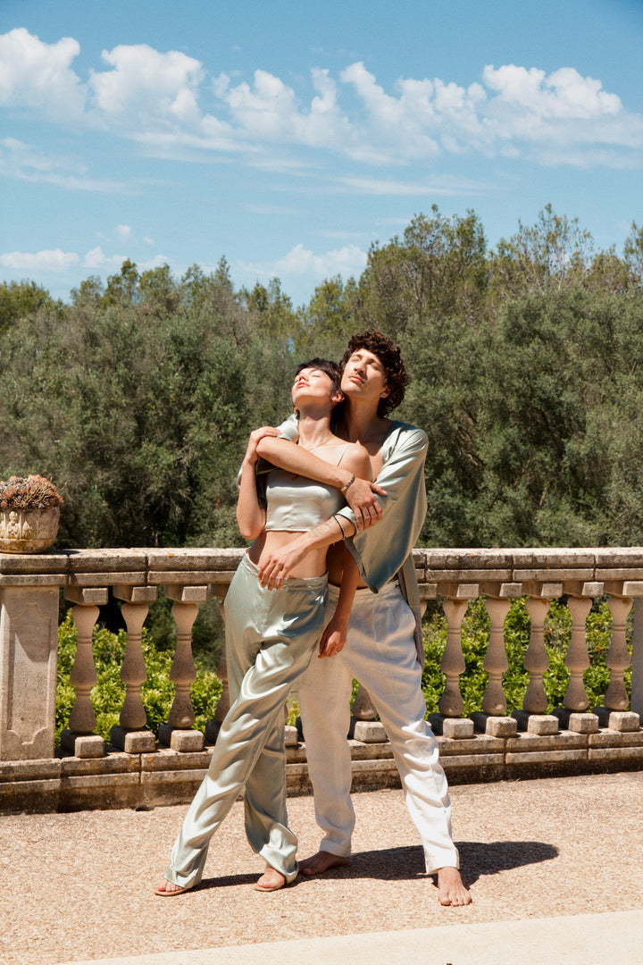 The Sage Bandeau Top in sage silk, stone terrace
