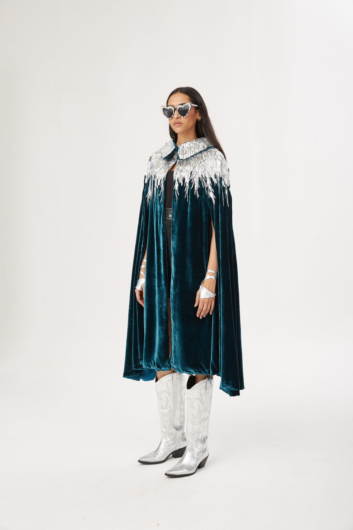The Silver Feather Cape in petrol silk velvet with silver beaded feathers, full length, studio