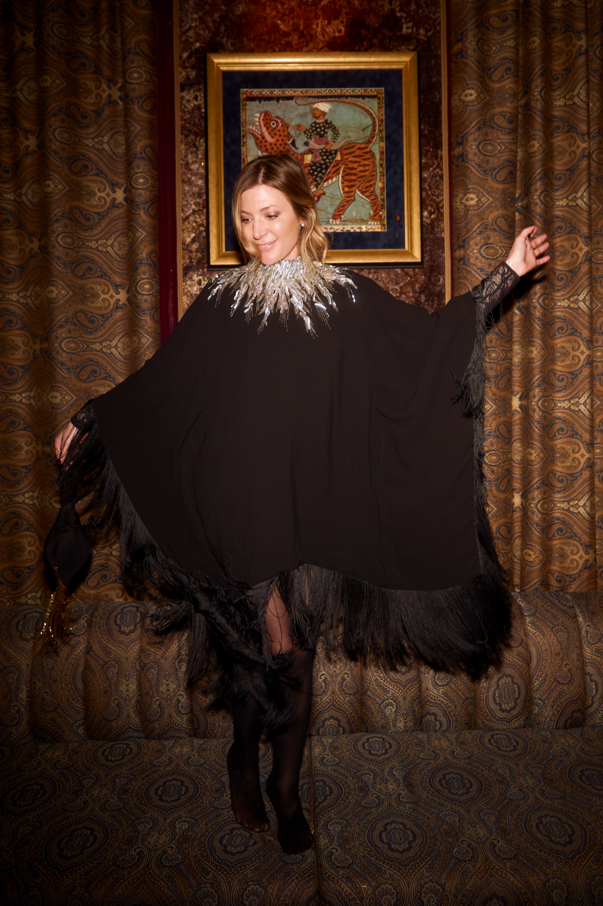 The Silver Feather Poncho in black silk georgette with silver feather embroidery, evening lounge