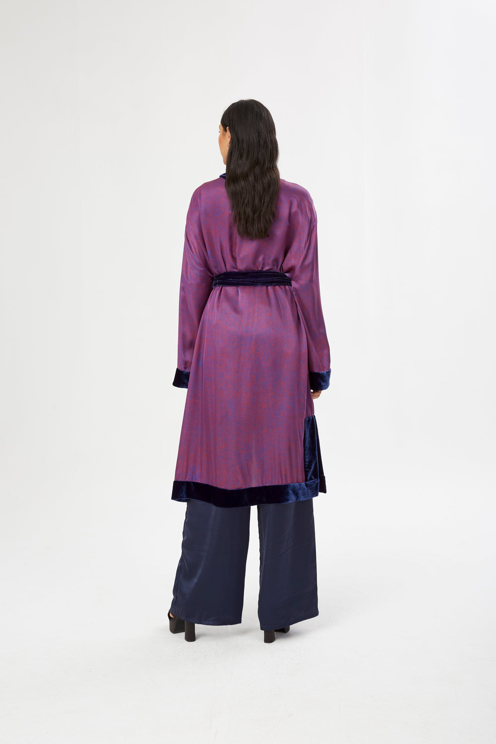 The Mazestroom Kimono, Navy and Red, in red and navy maze-print silk with velvet trim, back view, studio