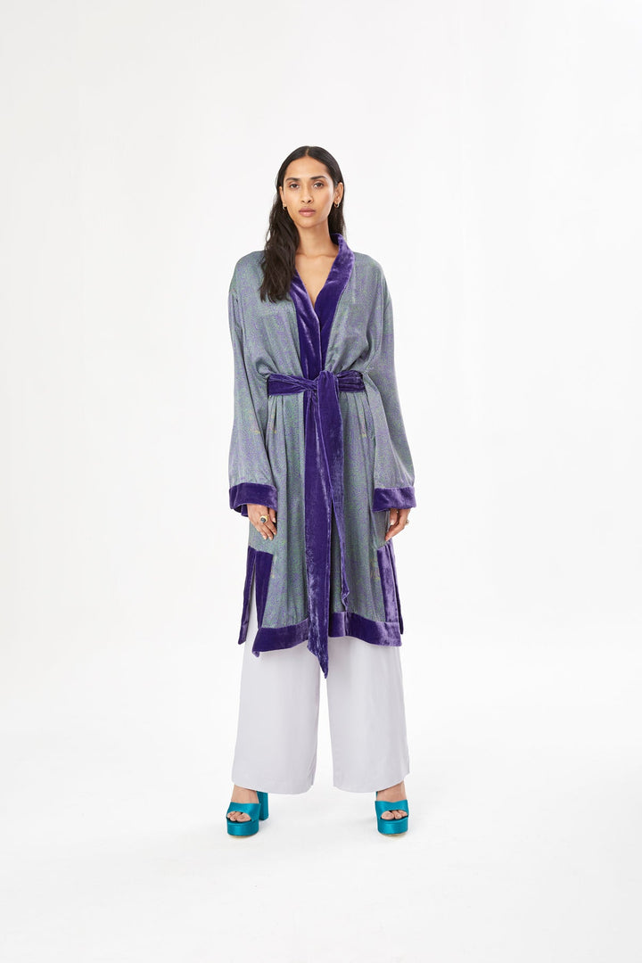The Mazestroom Kimono, Purple and Green, in iridescent green and purple maze-print silk with velvet trim, front view, studio