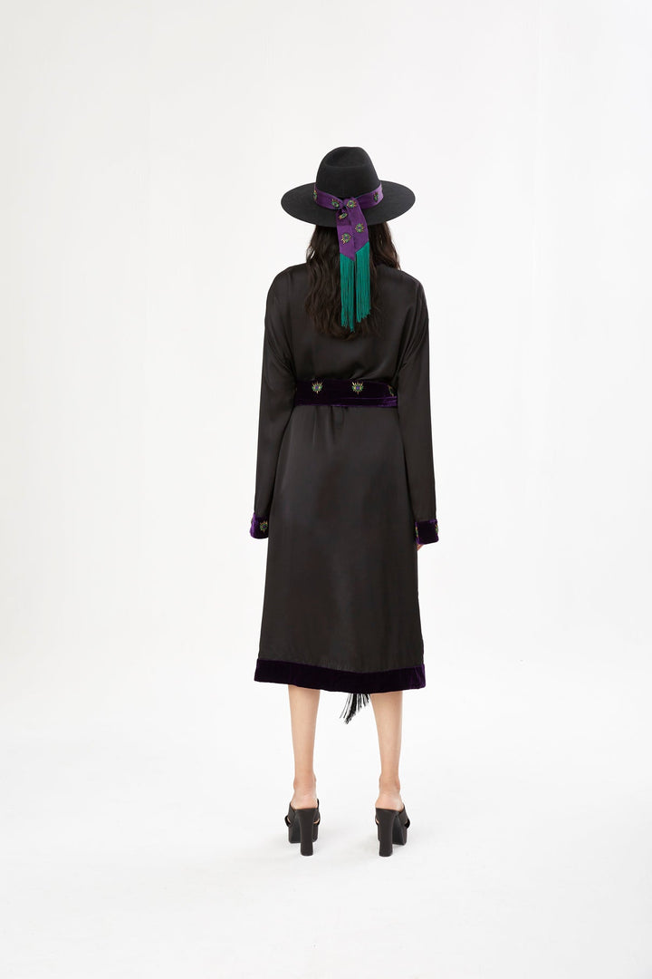 The Midnight Kimono in black silk with purple velvet trim and embroidery, back view, studio