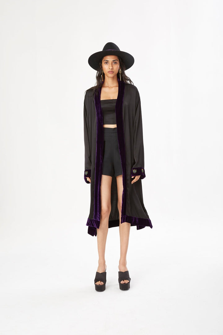 The Midnight Kimono in black silk with purple velvet trim and embroidery, front view, studio