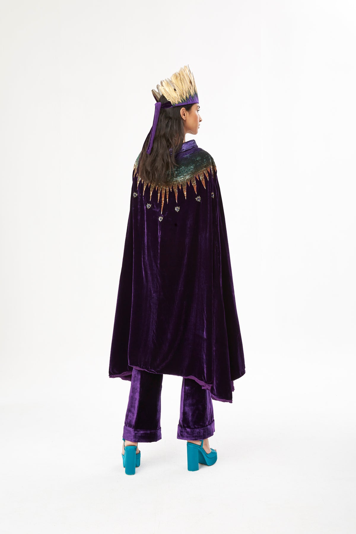 The Rainbow Cape in purple silk velvet with rainbow sequin collar, back view, studio