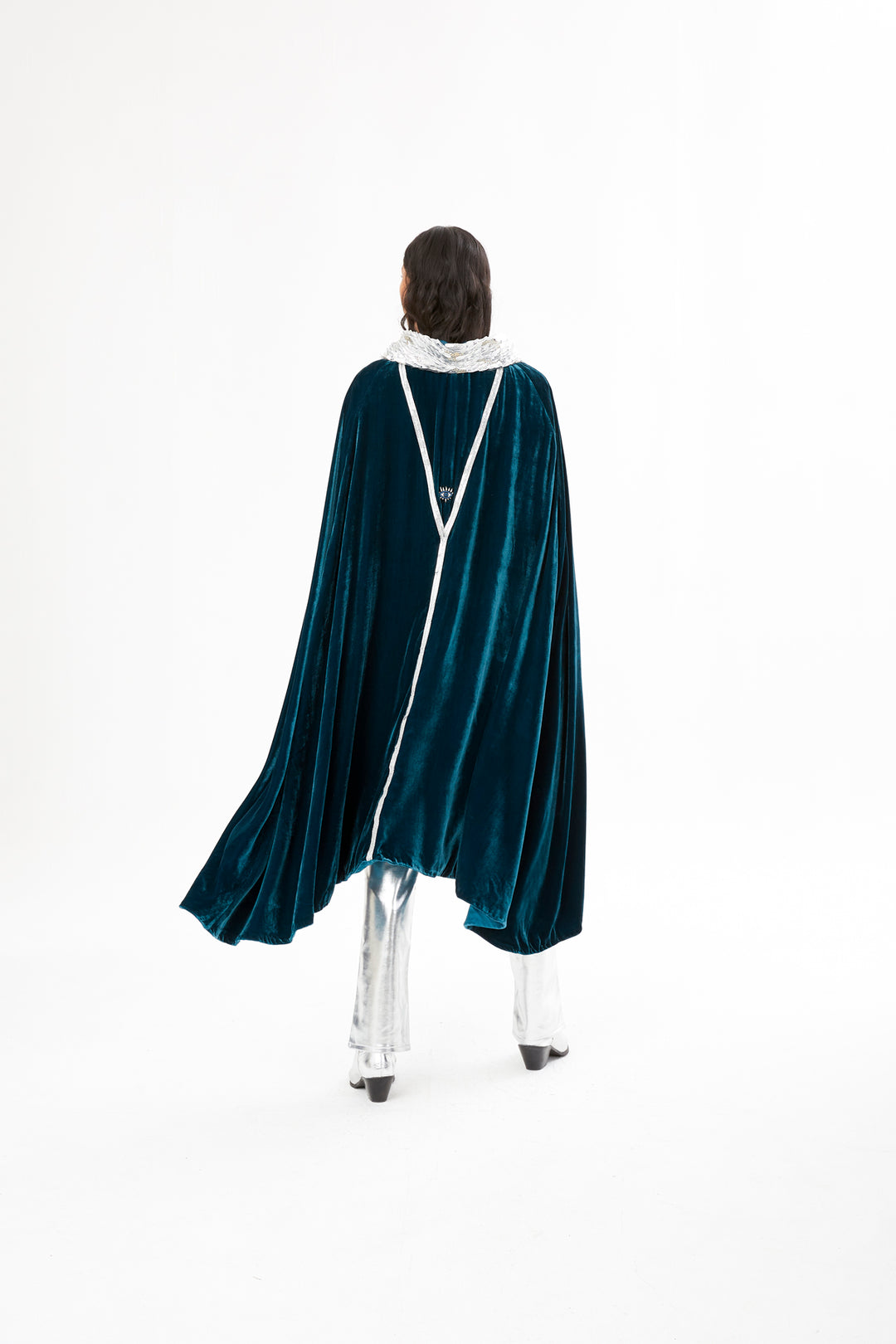 The Shining Collar Cape in petrol blue silk velvet with silver collar, back view with beaded detail, studio