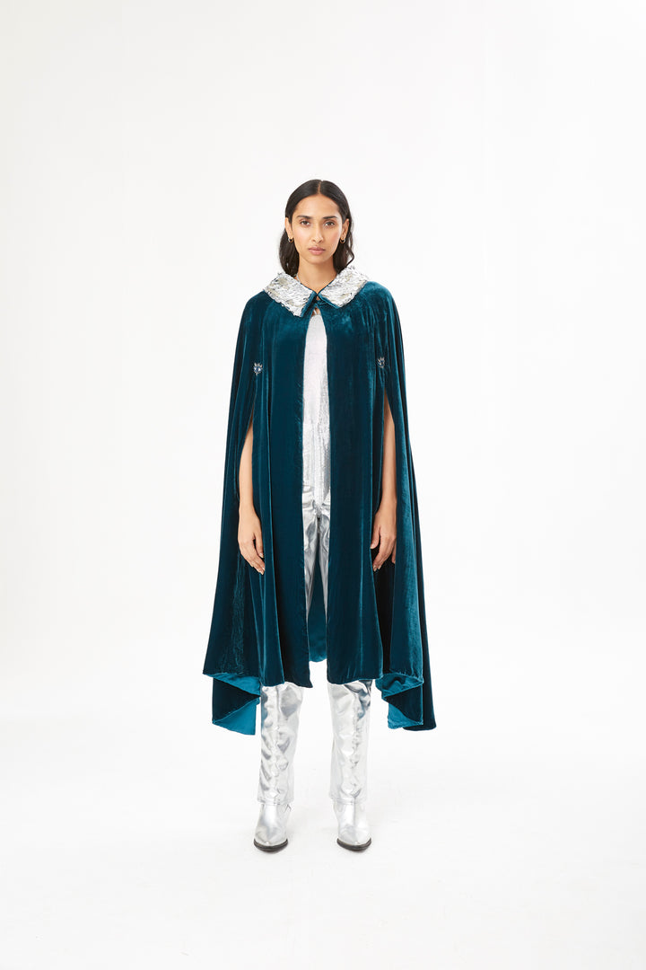 The Shining Collar Cape in petrol blue silk velvet with silver collar, front view, studio