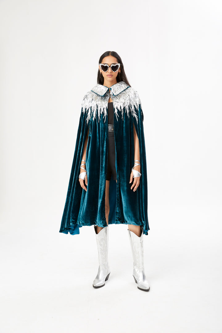 The Silver Feather Cape in petrol silk velvet with silver beaded feathers, front view, studio