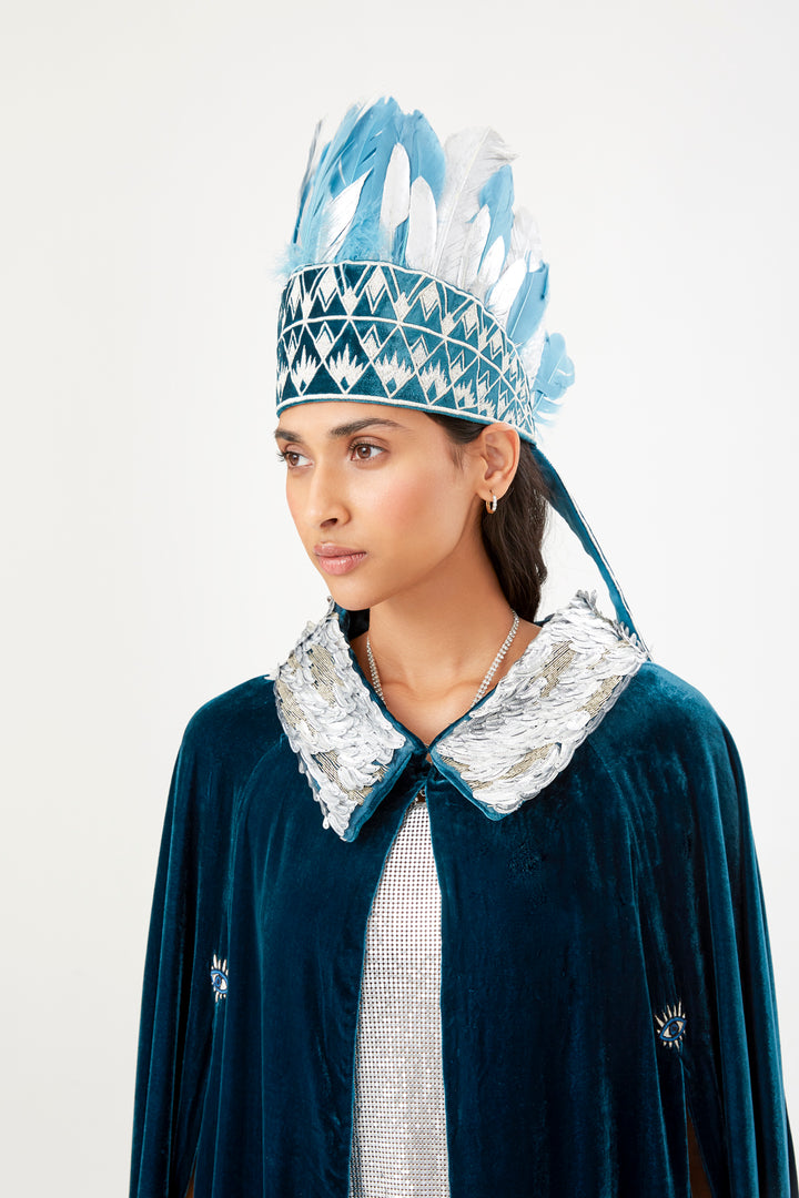 The Silver Feather Headdress with silver and pale blue feathers, side view, studio
